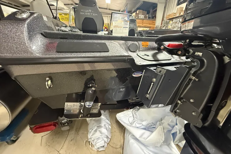 Slide: The Image of 2026 Skeeter WX1910 boat interior, showcasing seating and equipment in a showroom setting. - 4