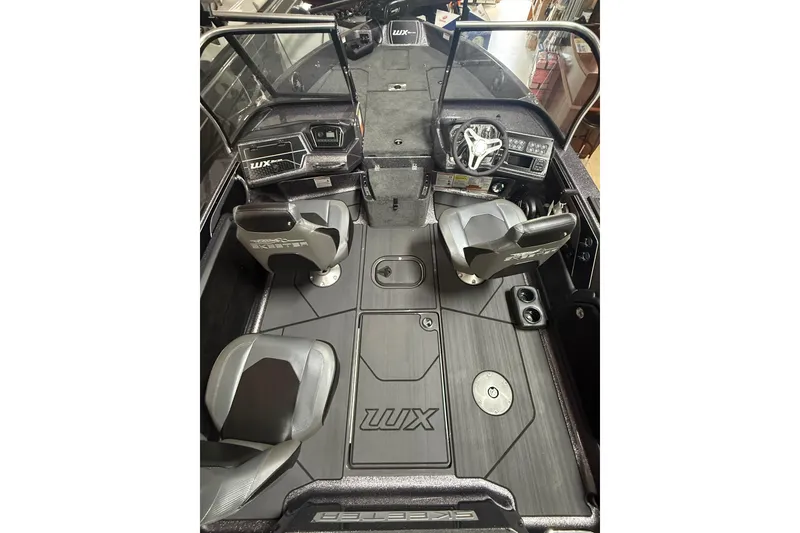 Slide: The Image of 2026 Skeeter WX1910 boat interior with sleek seating and modern dashboard design. - 6
