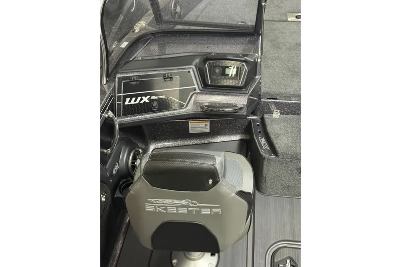 Slide: The Image of 2026 Skeeter WX1910 boat interior with dashboard and seat detail. - 7