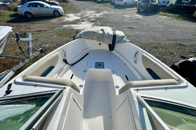 Slide: The Image of 2018 Chaparral 19 H2O Ski & Fish boat interior with seating and storage. - 15