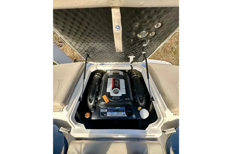 Slide: The Image of 2018 Chaparral 19 H2O Ski & Fish boat engine compartment, open view. - 19