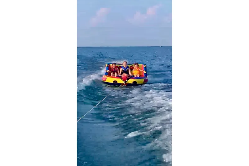 Slide: The Image of People tubing on water, pulled by 2018 Chaparral 19 H2O Ski & Fish boat. - 22