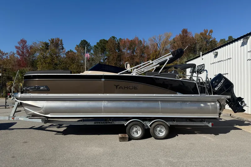 The Image of 2026 Tahoe Pontoon Cascade Quad Lounger Shift Windshield on trailer, outdoors. - 0