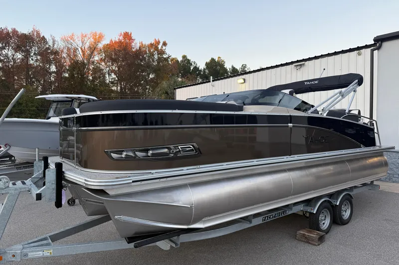 Slide: The Image of 2026 Tahoe Pontoon Cascade Quad Lounger Shift Windshield on trailer, autumn backdrop. - 1