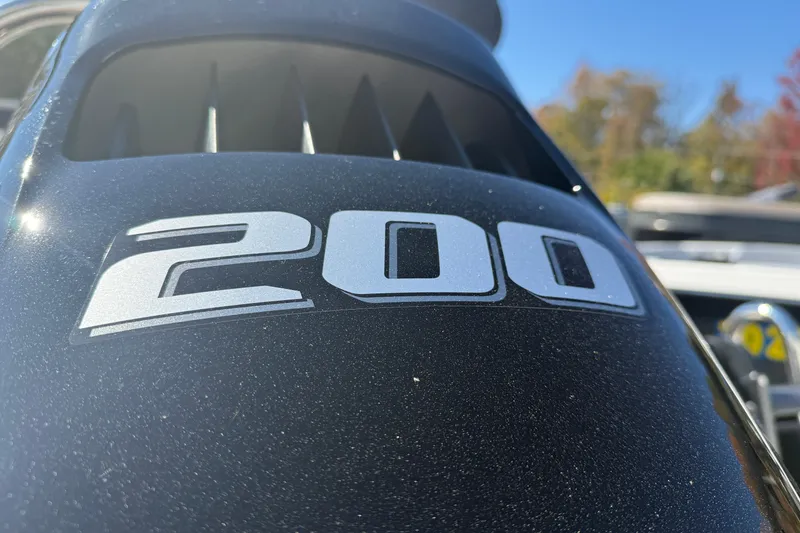Slide: The Image of Close-up of a 200 horsepower engine on a 2026 Tahoe Pontoon Cascade Quad Lounger. - 10
