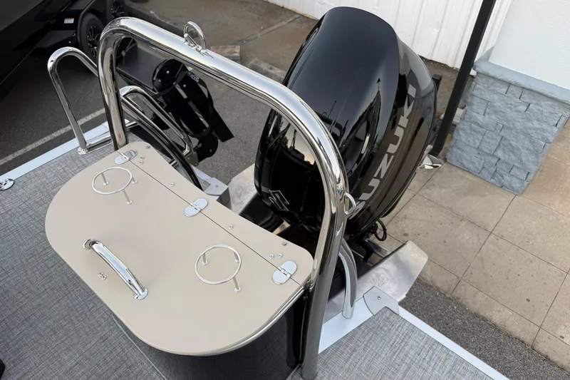 Slide: The Image of 2026 Tahoe Pontoon Cascade Quad Lounger with Suzuki outboard motor and sleek design. - 11