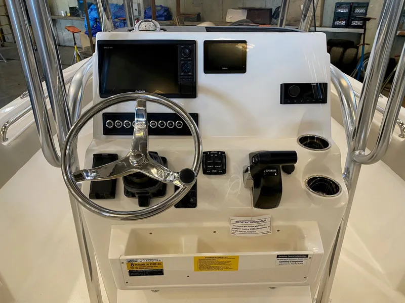 Slide: The Image of Steering console of 2026 Key West 203 FS boat with modern controls and displays. - 4