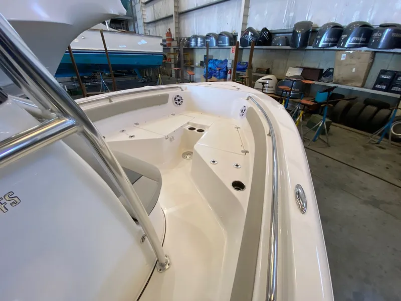 Slide: The Image of 2026 Key West 203 FS boat interior in a workshop, showcasing seating and storage areas. - 7