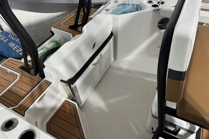 Slide: The Image of 2025 Starcraft SVX 211 OB CC boat interior with seating and storage compartments. - 17