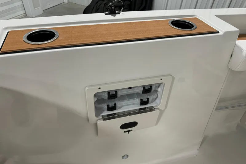 Slide: The Image of 2025 Starcraft SVX 211 OB CC boat with cup holders and storage compartment. - 11