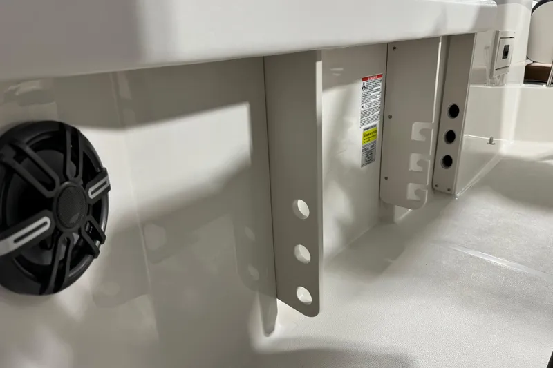 Slide: The Image of 2025 Starcraft SVX 211 OB CC boat interior with speaker and mounting brackets. - 21