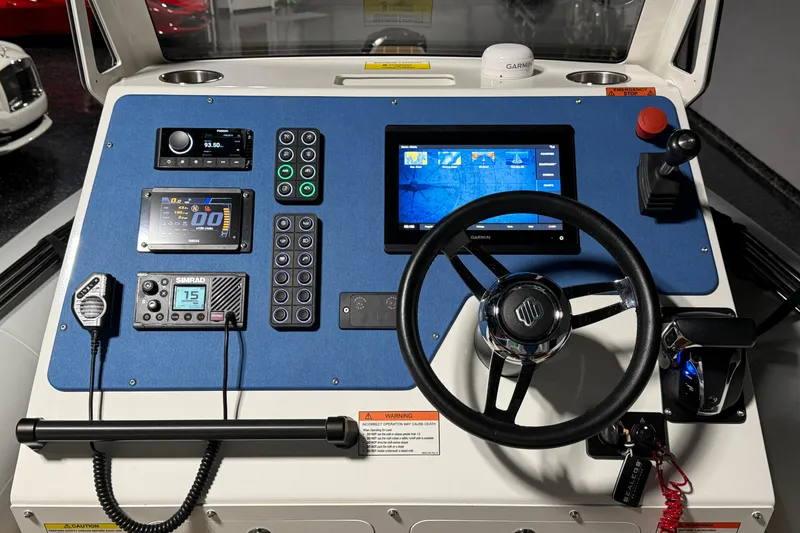 Slide: The Image of Control panel of a 2021 Sealegs 7.5M RIB with navigation and communication systems. - 12