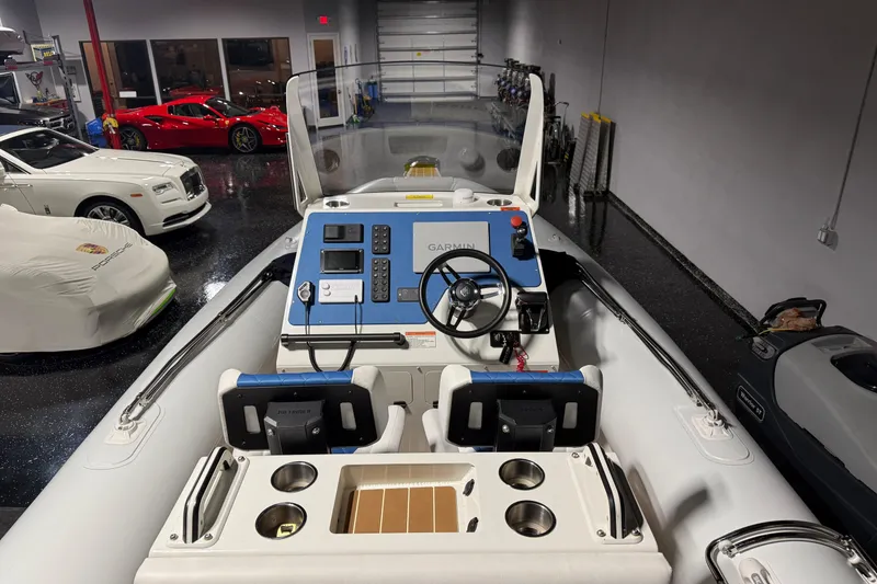 Slide: The Image of 2021 Sealegs 7.5M RIB in a luxury garage with sports cars. - 17