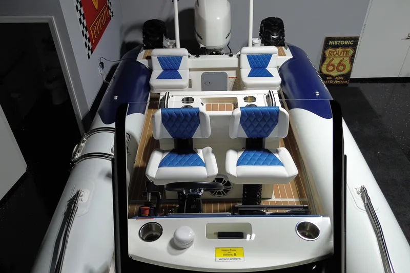 Slide: The Image of 2021 Sealegs 7.5M RIB with blue and white seating, viewed from above. - 20
