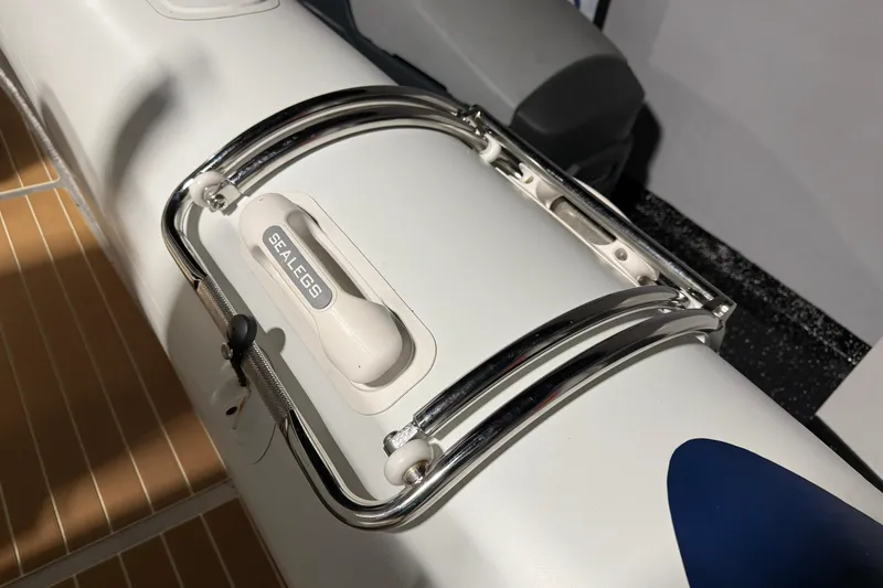 Slide: The Image of 2021 Sealegs 7.5M RIB boat detail with chrome railing and Sealegs branding. - 28