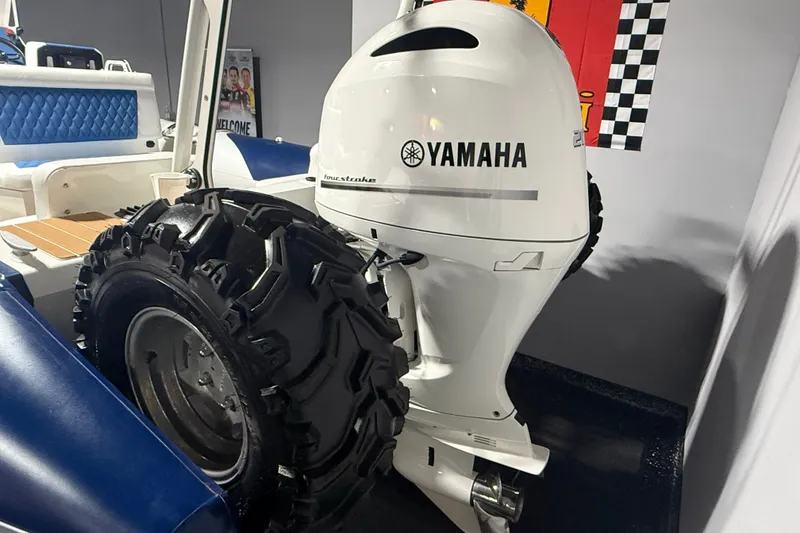 Slide: The Image of 2021 Sealegs 7.5M RIB with Yamaha engine and rugged wheels in showroom. - 31