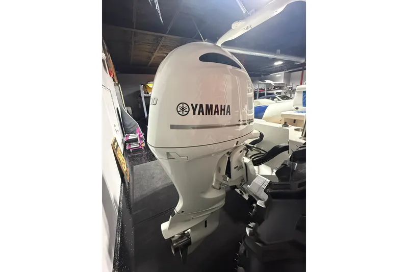Slide: The Image of Yamaha outboard motor on 2021 Sealegs 7.5M RIB in a showroom setting. - 32