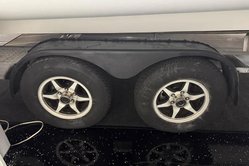 Slide: The Image of Trailer wheels of a 2021 Sealegs 7.5M RIB, featuring dual tires and fender. - 42