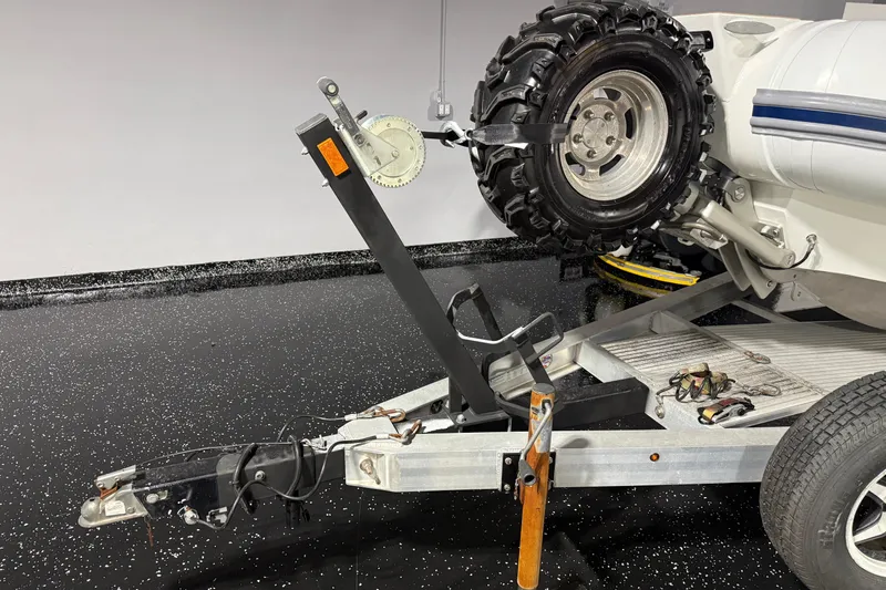 Slide: The Image of 2021 Sealegs 7.5M RIB on trailer with rugged tires in a garage setting. - 43