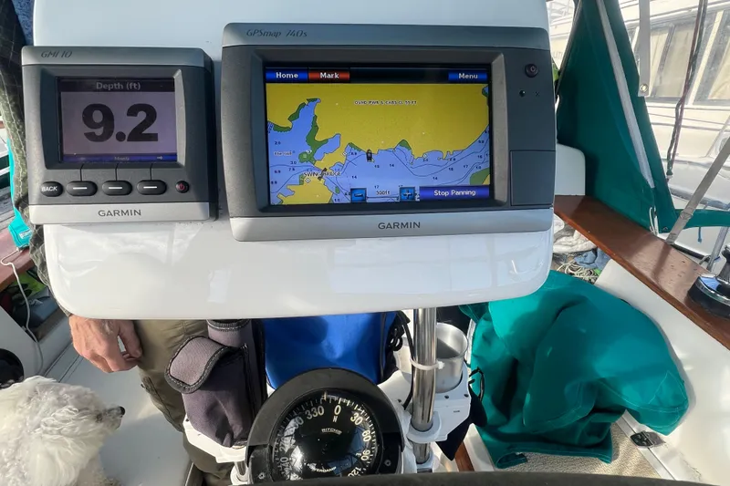 Slide: The Image of Garmin navigation system on 1993 Compac Sloop, displaying depth and map. - 17