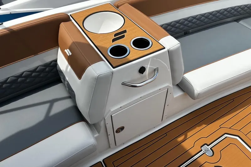 Slide: The Image of 2026 Starcraft SVX 211 OB boat interior with cup holders and stylish seating. - 11
