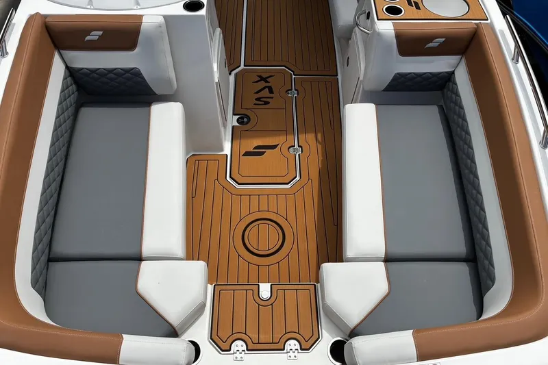 Slide: The Image of 2026 Starcraft SVX 211 OB boat interior with brown and gray seating, stylish deck design. - 23