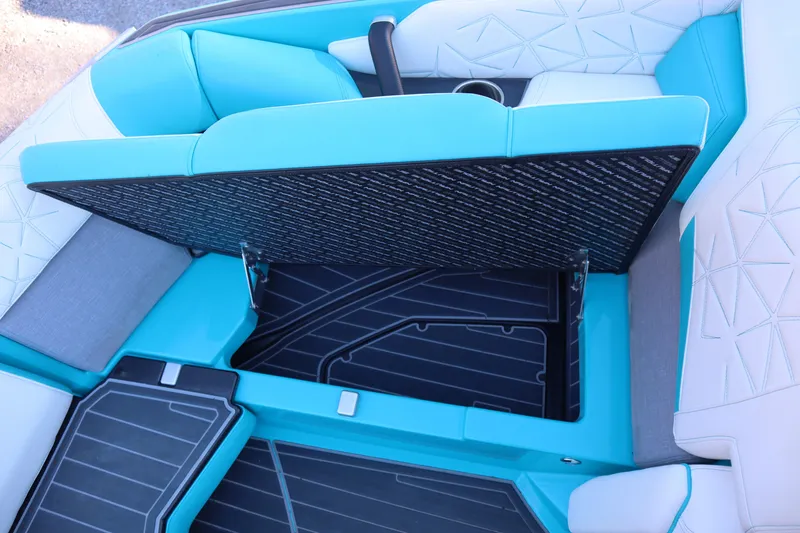 Slide: The Image of 2021 Nautique Super Air Nautique G23 Paragon interior with open storage compartment. - 14
