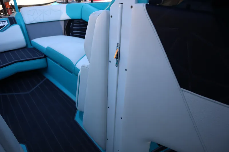 Slide: The Image of 2021 Nautique Super Air Nautique G23 Paragon interior with teal and white seating. - 19