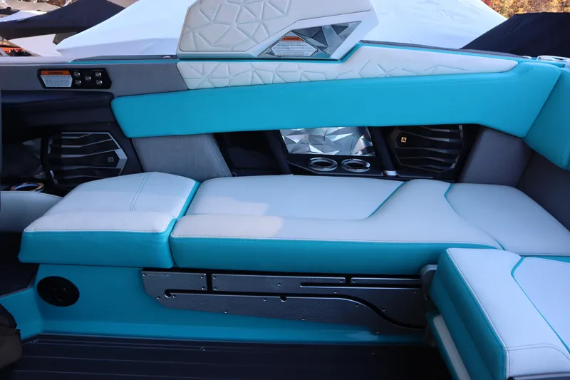 Slide: The Image of 2021 Nautique Super Air Nautique G23 Paragon interior with turquoise and white seating. - 26