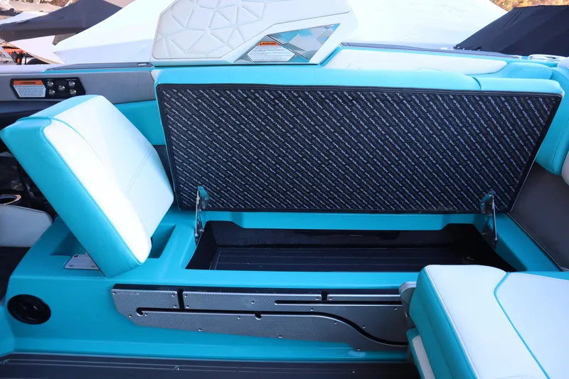Slide: The Image of 2021 Nautique Super Air Nautique G23 Paragon interior with open storage compartment. - 27