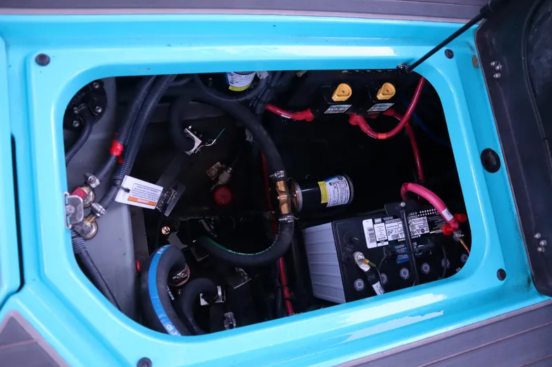 Slide: The Image of Engine compartment of 2021 Nautique Super Air Nautique G23 Paragon, showcasing wiring and components. - 29