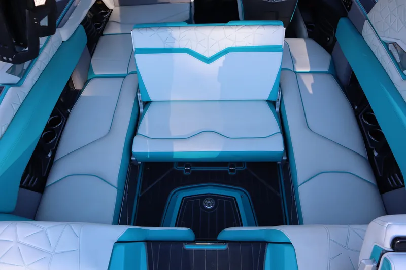Slide: The Image of 2021 Nautique Super Air Nautique G23 Paragon interior with teal and white seating. - 32