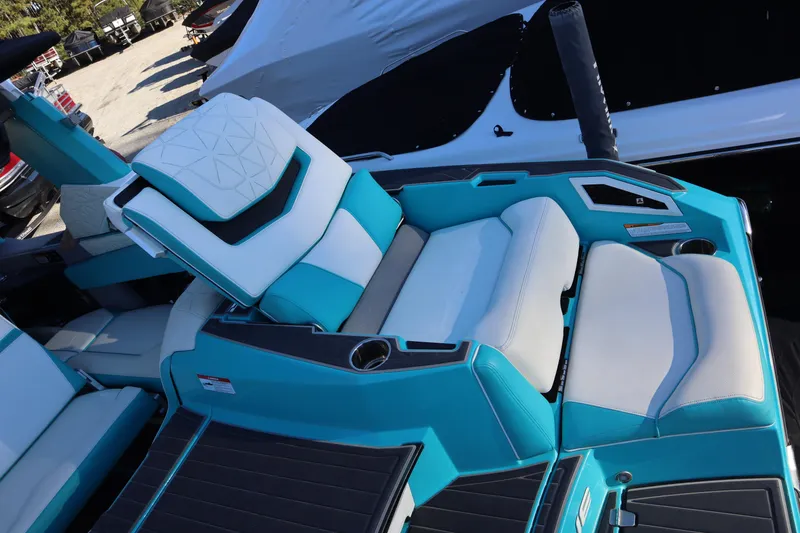 Slide: The Image of 2021 Nautique Super Air Nautique G23 Paragon interior with turquoise and white seating. - 33