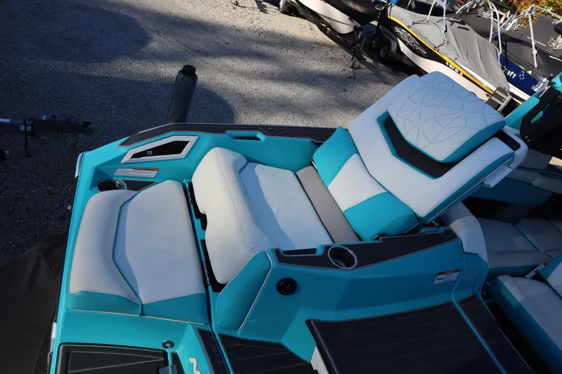 Slide: The Image of 2021 Nautique Super Air Nautique G23 Paragon boat interior with turquoise and white seating. - 34