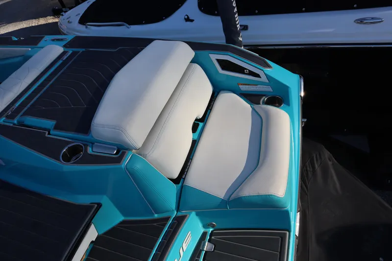 Slide: The Image of 2021 Nautique Super Air Nautique G23 Paragon boat interior with white and teal seating. - 36