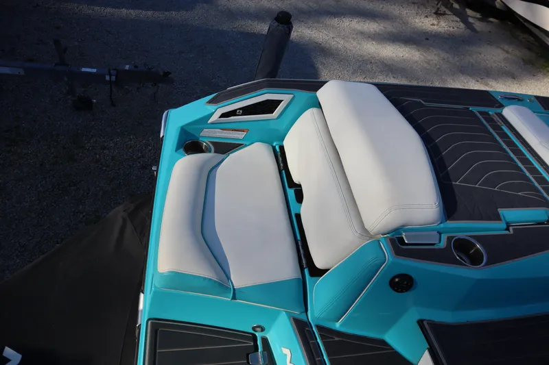 Slide: The Image of 2021 Nautique Super Air Nautique G23 Paragon boat interior with teal and white seating. - 37