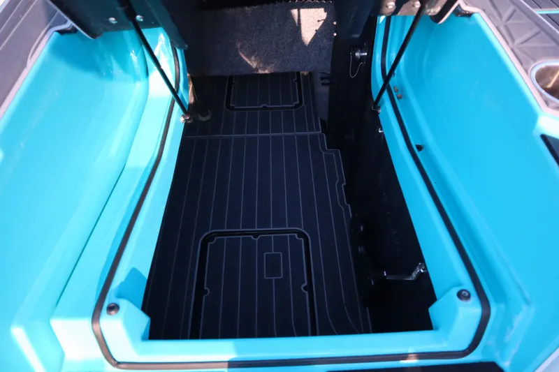 Slide: The Image of 2021 Nautique Super Air Nautique G23 Paragon storage compartment, featuring a sleek blue interior. - 38