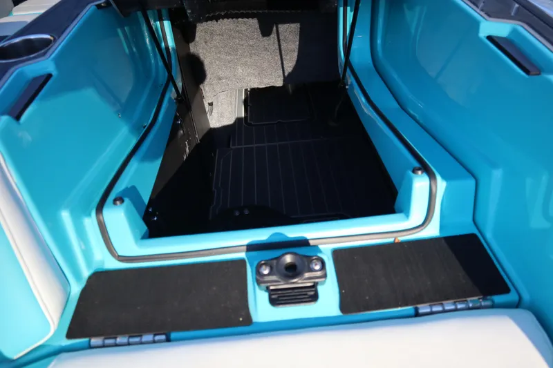 Slide: The Image of Interior view of 2021 Nautique Super Air Nautique G23 Paragon boat, featuring blue accents. - 39