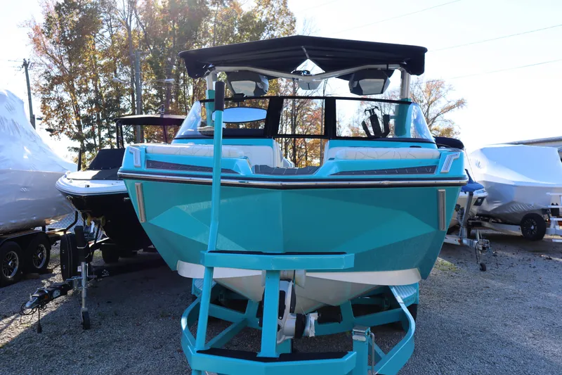 Slide: The Image of 2021 Nautique Super Air Nautique G23 Paragon in vibrant blue, displayed outdoors. - 5