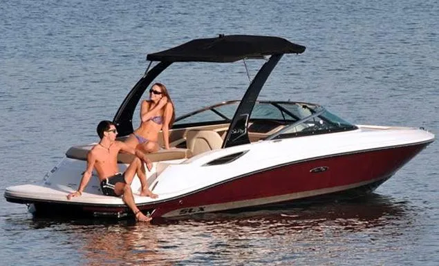Slide: The Image of Manufacturer Provided Image: 2013 Sea Ray 210 SLX boat with two people relaxing on the water. - 17