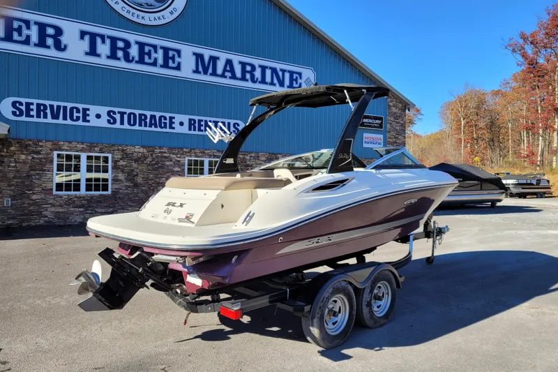Slide: The Image of 2013 Sea Ray 210 SLX boat on trailer at Deer Tree Marine dealership. - 2