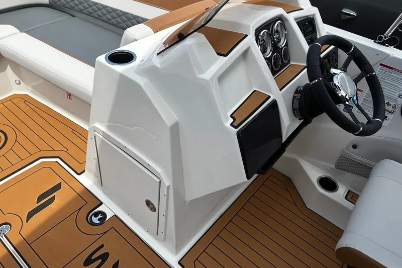 Slide: The Image of 2026 Starcraft SVX 211 OB boat interior with modern dashboard and seating. - 12