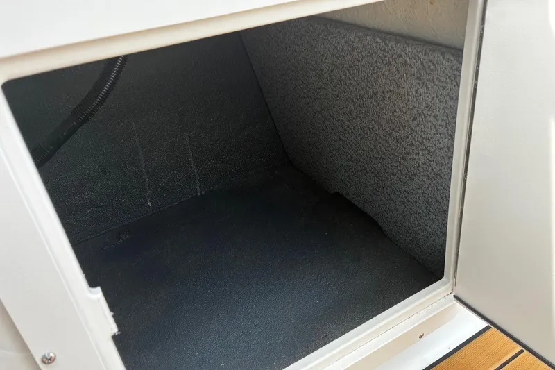 Slide: The Image of Storage compartment of 2026 Starcraft SVX 211 OB boat, featuring a spacious interior. - 17