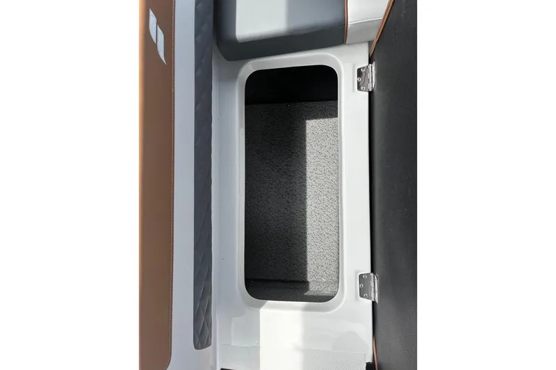 Slide: The Image of Storage compartment in 2026 Starcraft SVX 211 OB boat, featuring sleek design and durable materials. - 9