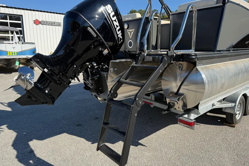 Slide: The Image of 2026 Tahoe Pontoon Cascade Quad Lounger Windshield with Suzuki outboard motor and ladder. - 11