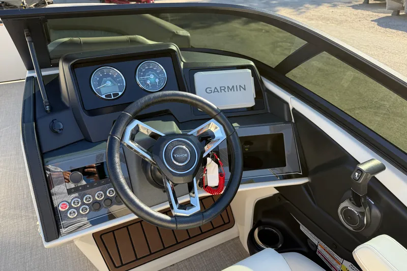 Slide: The Image of 2026 Tahoe Pontoon Cascade Quad Lounger Windshield dashboard with Garmin navigation system. - 6