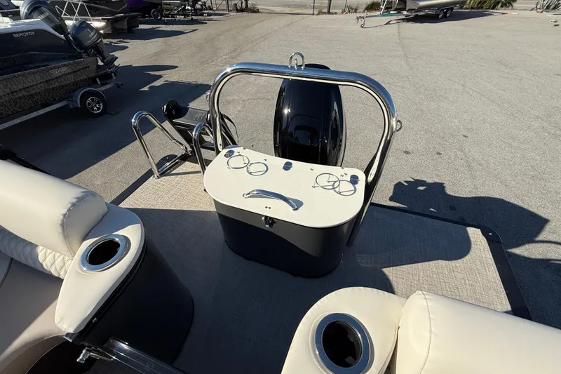 Slide: The Image of 2026 Tahoe Pontoon Cascade Quad Lounger Windshield, rear view with seating and motor. - 7
