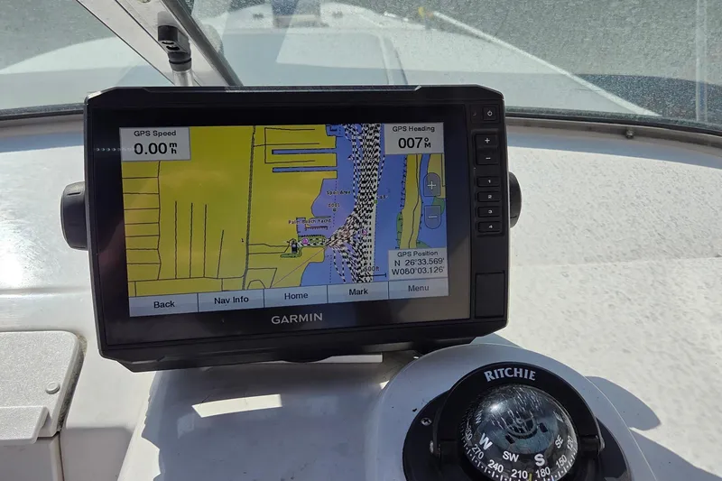 Slide: The Image of Garmin GPS and compass on 2001 Pro-Line 22 Walk boat dashboard. - 7