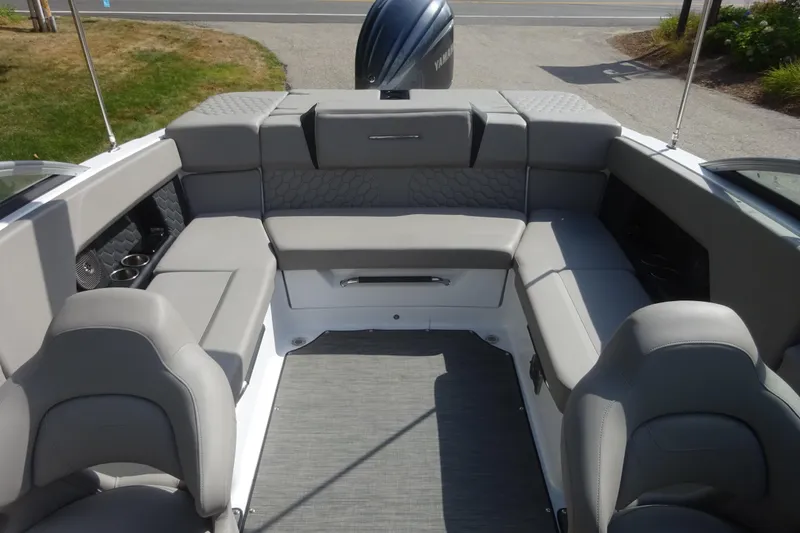 Slide: The Image of 2022 Four Winns H4 OB boat interior with gray seating and modern design. - 19