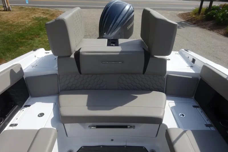 Slide: The Image of 2022 Four Winns H4 OB boat interior with gray seating and Yamaha outboard motor. - 20